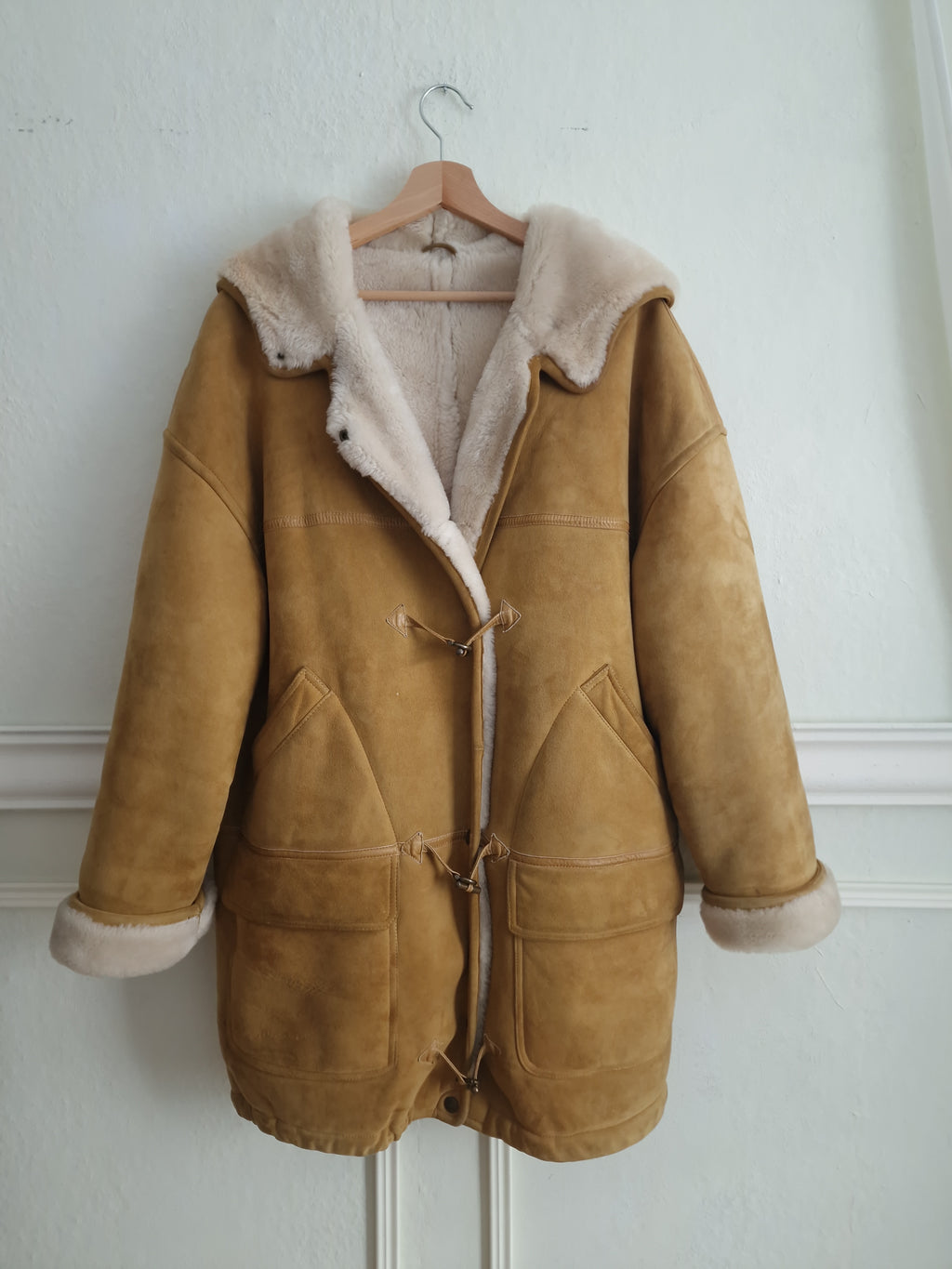Vintage sheepskin coat in warm camel